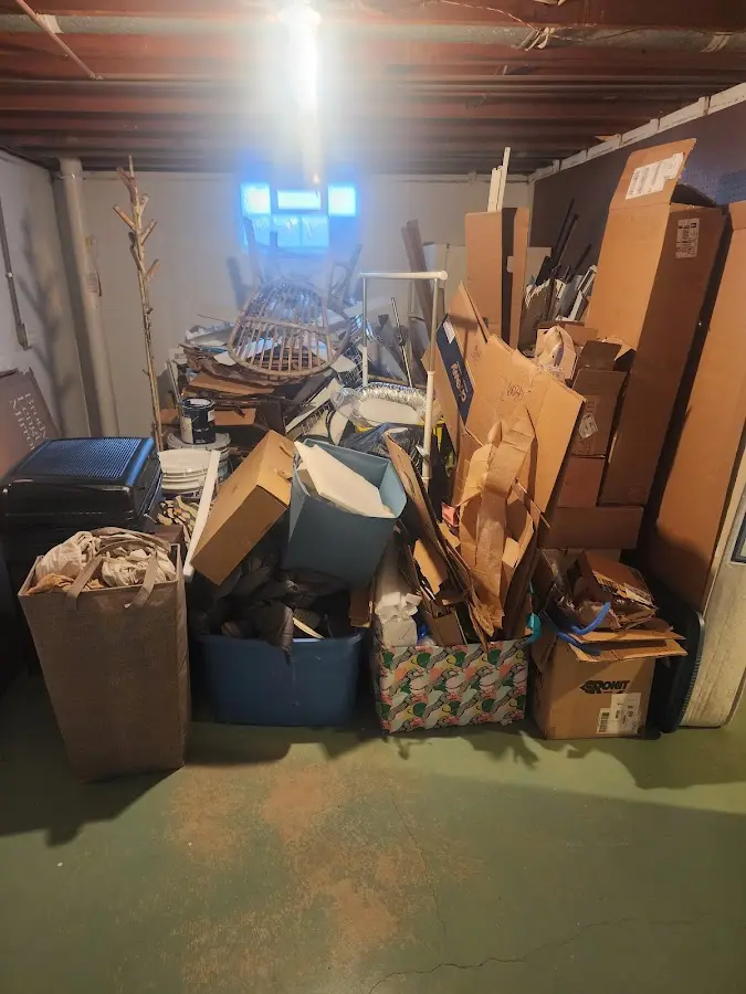 Roll-off dumpster container at job site for 8 Yard Dumpster Rental in Monmouth Beach