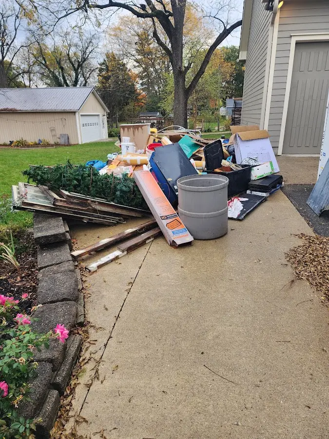 Dumpster being loaded with debris for 30 Yard Dumpster Rental in Monmouth Beach